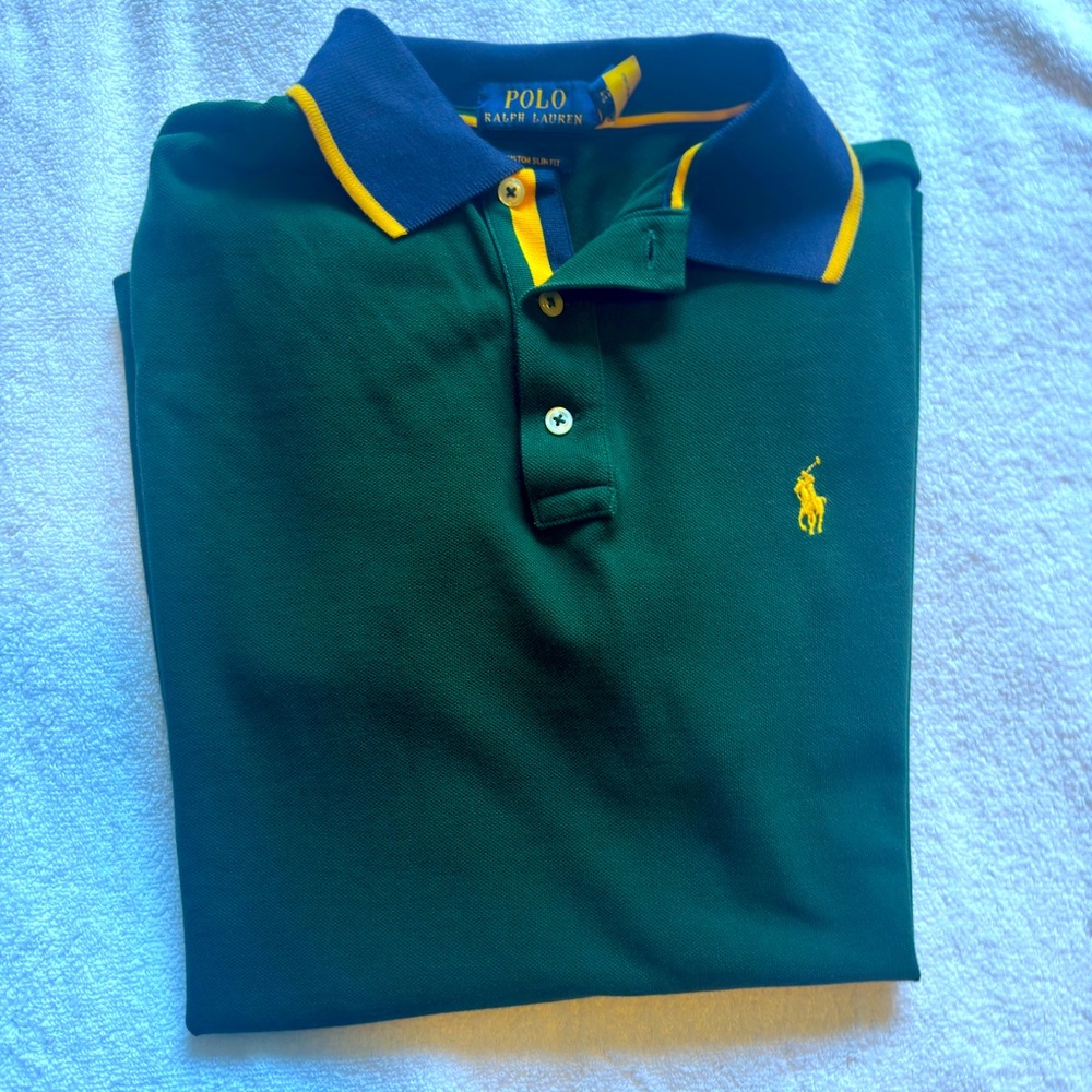Ralph Lauren Polo. Is a median fit but is more like a regular small